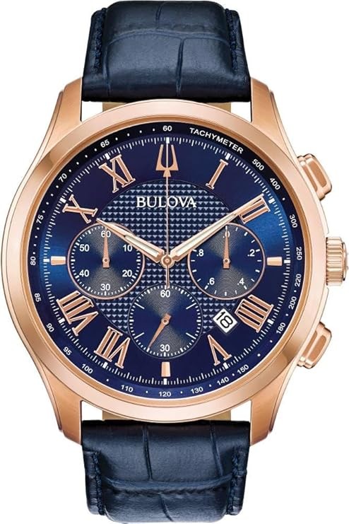 Bulova Men's Classic Wilton 3-Hand Chronograph Watch, Luminous Hands, Roman Numeral Markers Domed Mineral Crystal, 43mm, Blue Strap/ Rose Gold